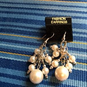 Handcrafted Ivory glass pear earrings.